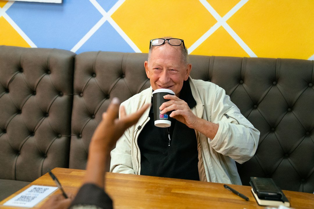 Elderly Danish man being interviewed at home for a documentary story