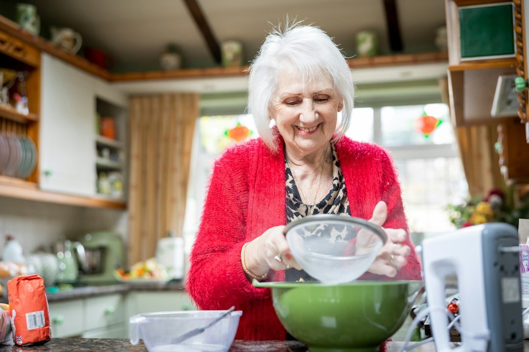 elderly woman baking bread