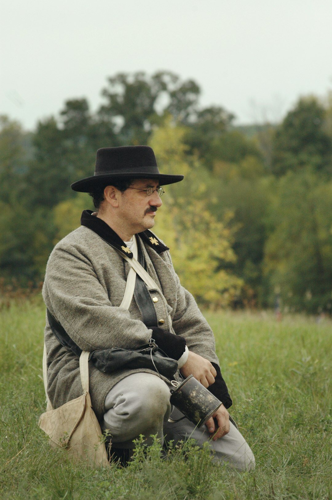 photographer with camera in field